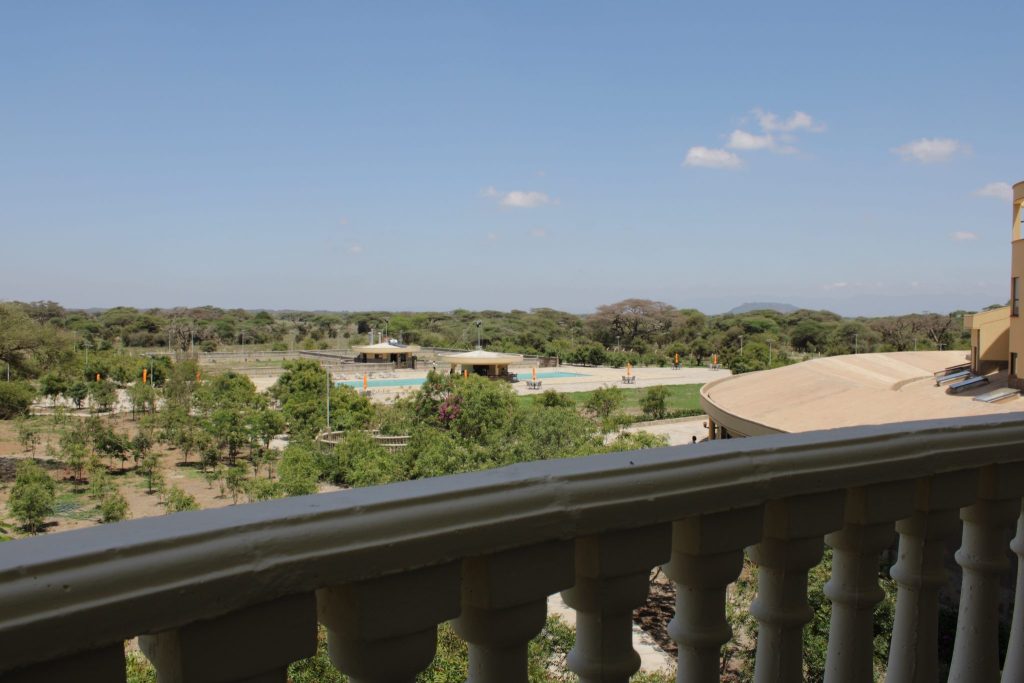 Scenic view from the private terrace of an Executive Terrace Room, overlooking Kimana Sanctuary, the Chyulu Hills, swimming pool and surrounding savannah landscape.
